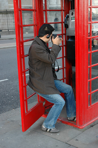 Tourist with telephone box, London
