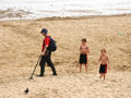 Metal detector and two boys, Bournemouth