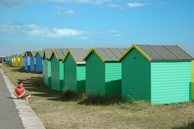 Boy and beach huts, Littlehampton