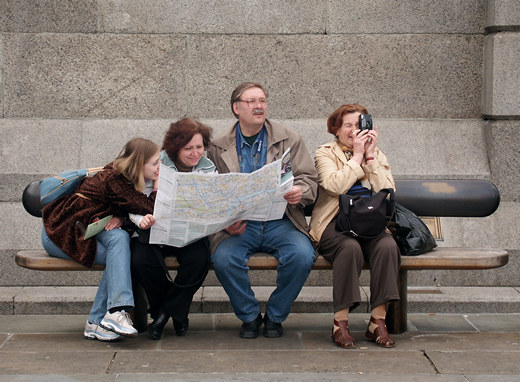 Tourists with map, Trafalgar Square, London